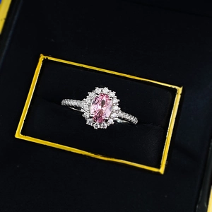 S925 silver ring featuring an oval pink sapphire simulant with halo diamond setting