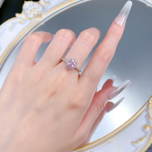 Elegant S925 silver halo ring with oval pink gemstone and shimmering pavé side stones