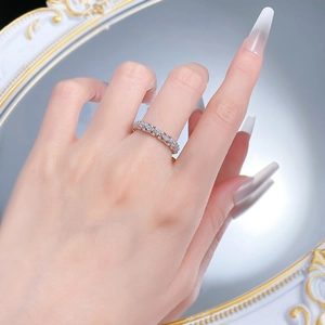 Detail of S925 silver lace ring with pavé diamonds shown on a person's finger