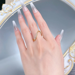 S925 silver wave ring with zircons worn on model finger against mirror background