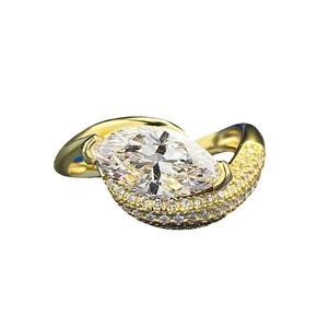 Elegant 925 silver marquise cut diamond ring with pavé-set side stones in gold finish
