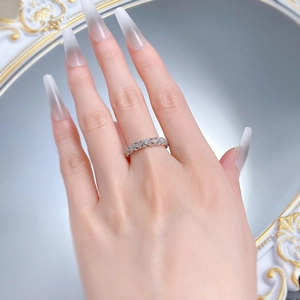 Detailed close-up of retro S925 silver hollow lace ring with shimmering pavé diamonds