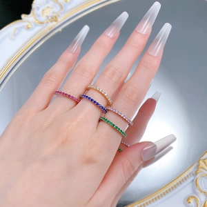 Close-up of five colorful slim S925 silver rings with micro-pave cubic zirconia