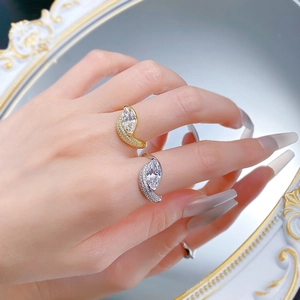 Macro shot of 925 silver rings with marquise cut stones and wavy micro-paved bands