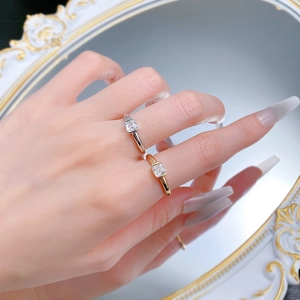 Detail of S925 silver Asscher cut rings in gold and silver finish on hand