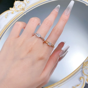 Close-up of silver and gold S925 rings featuring Asscher cut white square zirconia