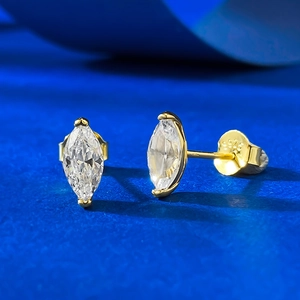 Minimalist S925 sterling silver gold-plated marquise cut stud earrings on blue background