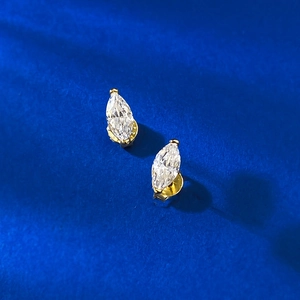 S925 silver marquise-cut studs with gold-plated finish and clear stones on blue satin