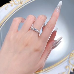 Detailed view of S925 silver ring with brushed texture and a sparkling 5mm white diamond