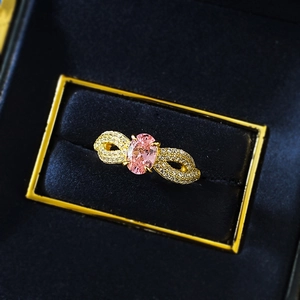 S925 silver ring with oval pink sapphire and pavé diamonds in a blue velvet box