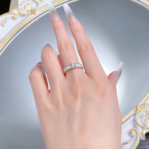 Detailed close-up of a brushed S925 silver ring featuring a four-prong set round diamond