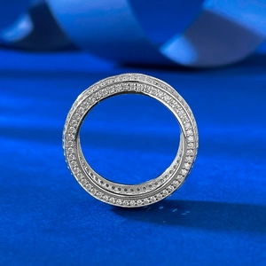 S925 silver eternity ring with full pavé diamonds on a dark blue satin background