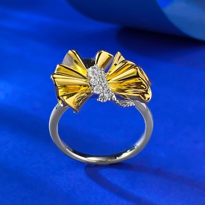 Macro view of S925 silver ginkgo leaf ring with sparkling pavé zircons and pleated textures