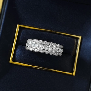 Detailed macro view of S925 silver luxury ring with triple-row pavé set cubic zirconia