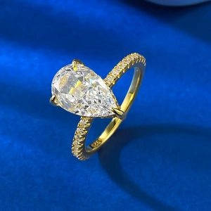 Elegant gold plated S925 silver ring featuring a 7x11mm pear cut white ice stone