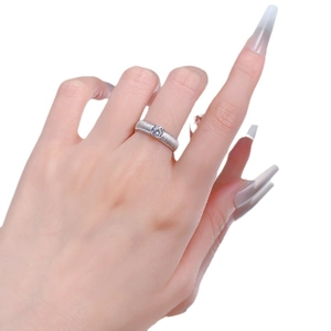 S925 sterling silver brushed ring with a single white diamond in a minimalist design
