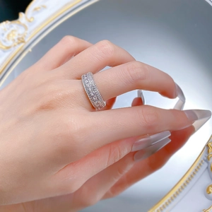 Macro shot of S925 silver wide band ring encrusted with sparkling rows of cubic zirconia