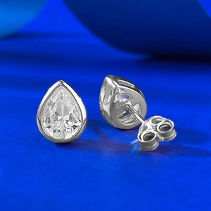 Close-up of S925 silver pear cut moissanite stud earrings with bezel setting detail
