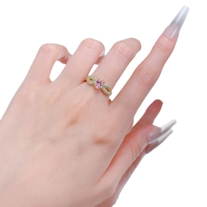 S925 silver oval pink gemstone ring with twisted gold band shown on model's finger