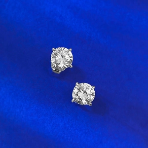 Macro detail of classic round brilliant-cut earrings with four-prong S925 silver setting