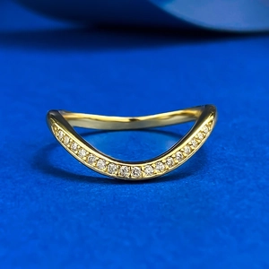 Elegant V-shaped gold ring with pavé diamonds featuring minimalist stacking design