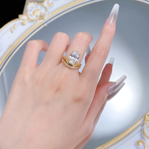 Close-up of elegant gold S925 silver ring set with large oval cubic zirconia on hand