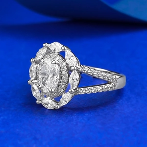 Luxurious S925 silver oval ring with halo cluster of marquise diamonds on blue stand