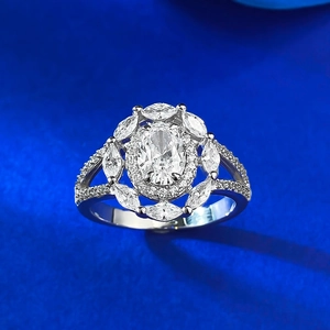 Macro shot of S925 silver oval diamond ring with floral halo and split shank detail
