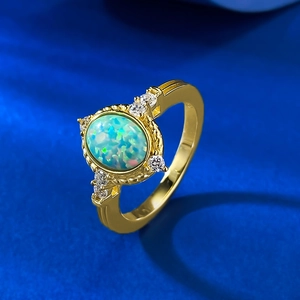 Elegant vintage S925 silver gold-plated ring with oval opal and sparkling side diamonds