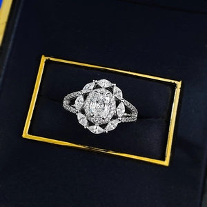Luxurious S925 silver oval-cut halo ring with marquise cluster diamonds in a black jewelry box