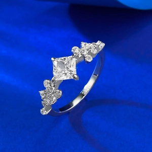 Macro detail of S925 silver ring featuring a square zircon stone and cluster accents