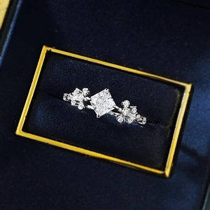 Elegant S925 silver princess cut ring with floral accents in a velvet jewelry box