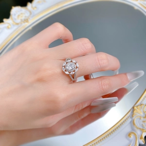 Detail of S925 silver oval-cut halo cluster ring with sparkling marquise stones