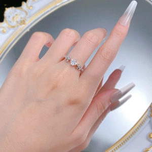 Close-up of S925 silver ring featuring a princess cut center stone and side diamonds