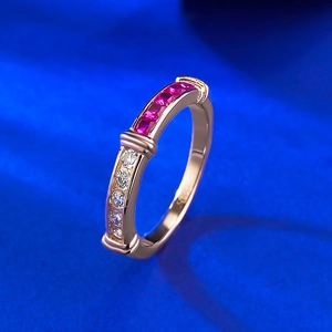 S925 silver eternity ring with square red gems and round white stones on blue silk