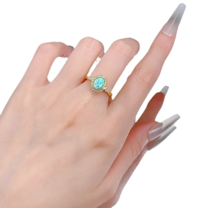Vintage gold S925 silver ring featuring an oval opal stone and small white diamonds