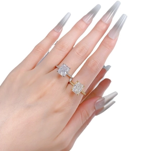 Radiant cut 8x10mm carbon diamond ring in gold and silver finish on hand