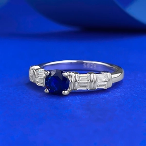 Elegant S925 sterling silver ring featuring a round blue sapphire stone and clear accents