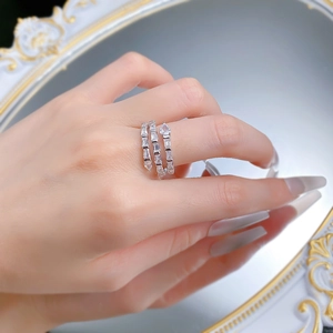Macro detail of silver snake wrap ring featuring pavé set baguette and teardrop zircons