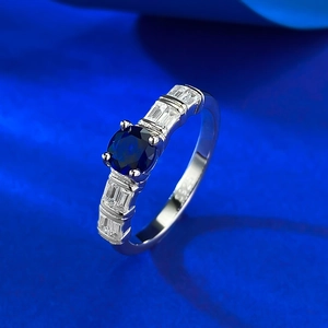 Elegant S925 silver ring featuring a round blue sapphire zircon and side accent diamonds