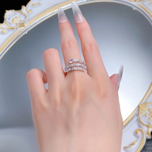 Close-up of S925 silver snake-shaped ring with pear and baguette cut cubic zirconia