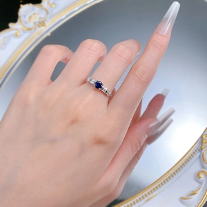 Elegant S925 sterling silver ring featuring a round blue sapphire with rectangular side stones