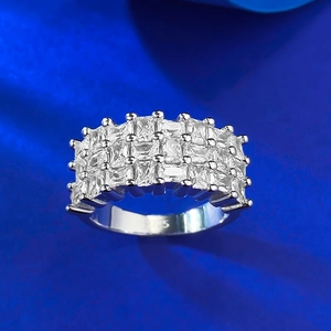 Macro detail of S925 sterling silver ring featuring triple rows of baguette cut zircons
