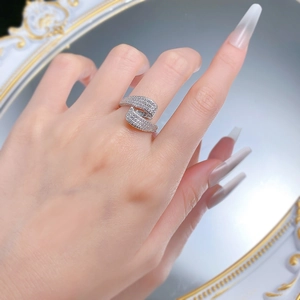 Macro shot of S925 silver S-shaped crisscross ring with full pavé cubic zirconia