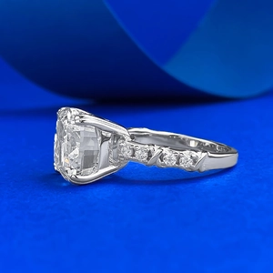 Macro view of cushion-cut crystal ring with micro-paved diamonds and cross texture