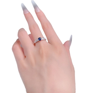 Elegant S925 silver ring with oval blue sapphire and baguette side diamonds on hand