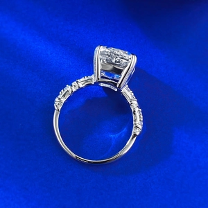 Macro side view of 10x10mm ice flower cut cushion stone ring with pavé diamond band