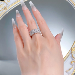 Close-up of S925 silver wide band ring featuring triple rows of rectangular cubic zirconia