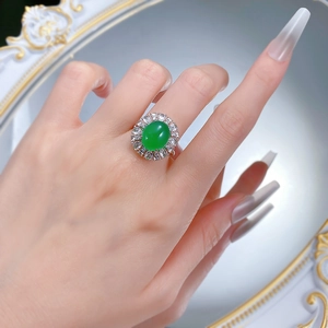 Elegant silver ring featuring oval green chalcedony stone with a halo of white zircon