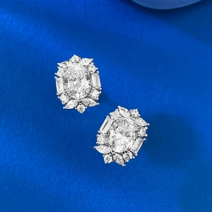 Elegant 7x9mm oval cut solitaire earrings with floral diamond cluster halo in silver